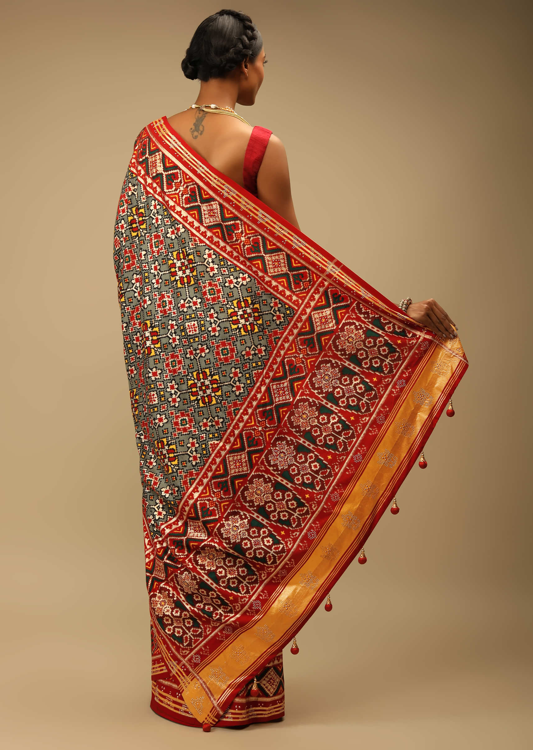 Red And Green Saree In Soft Silk With Patola Print And Stick On Kundan Work 