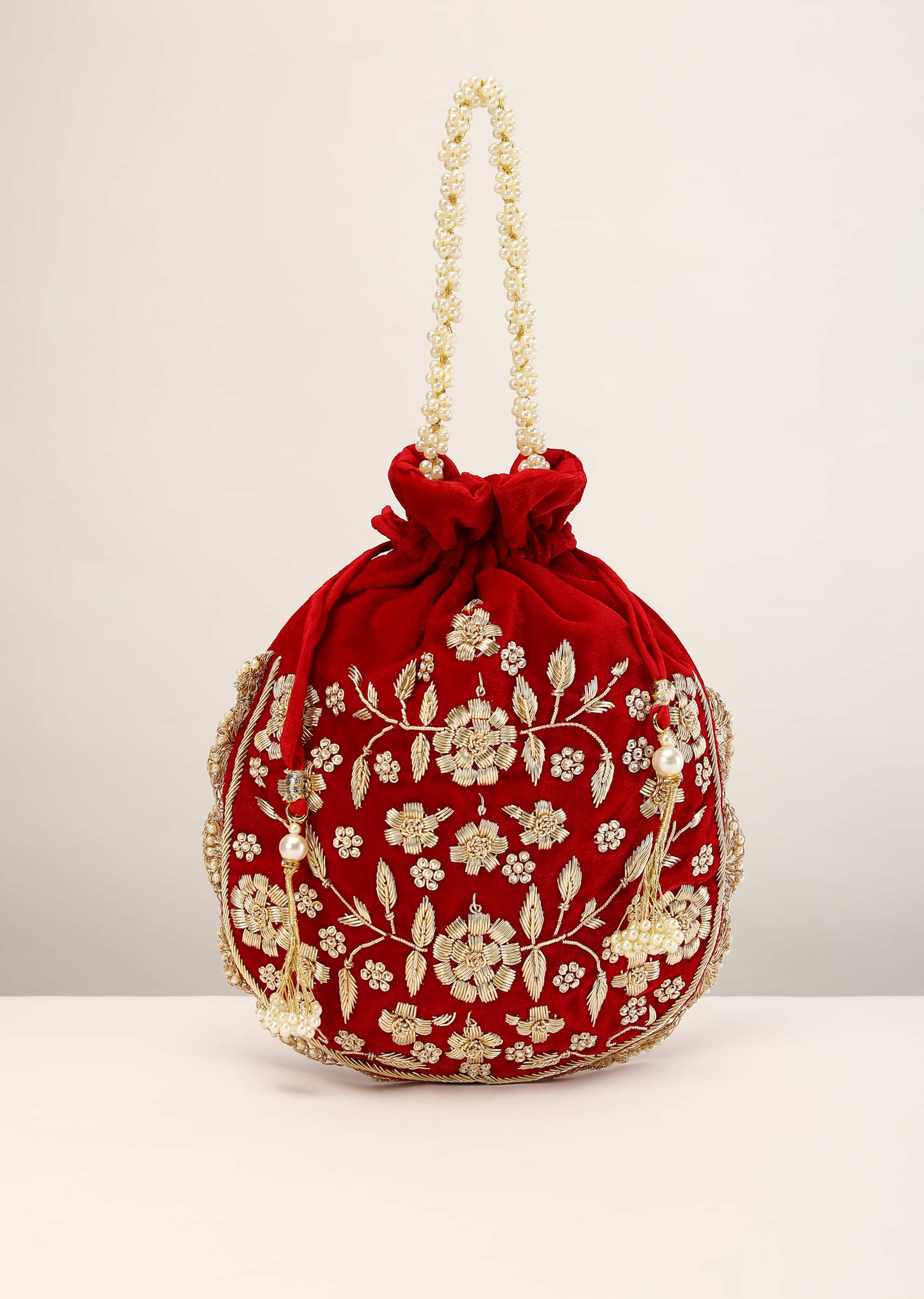 Red Velvet Potli  With Hand Embroidery Detailing Using Zardosi And Moti Embroidered Floral Design