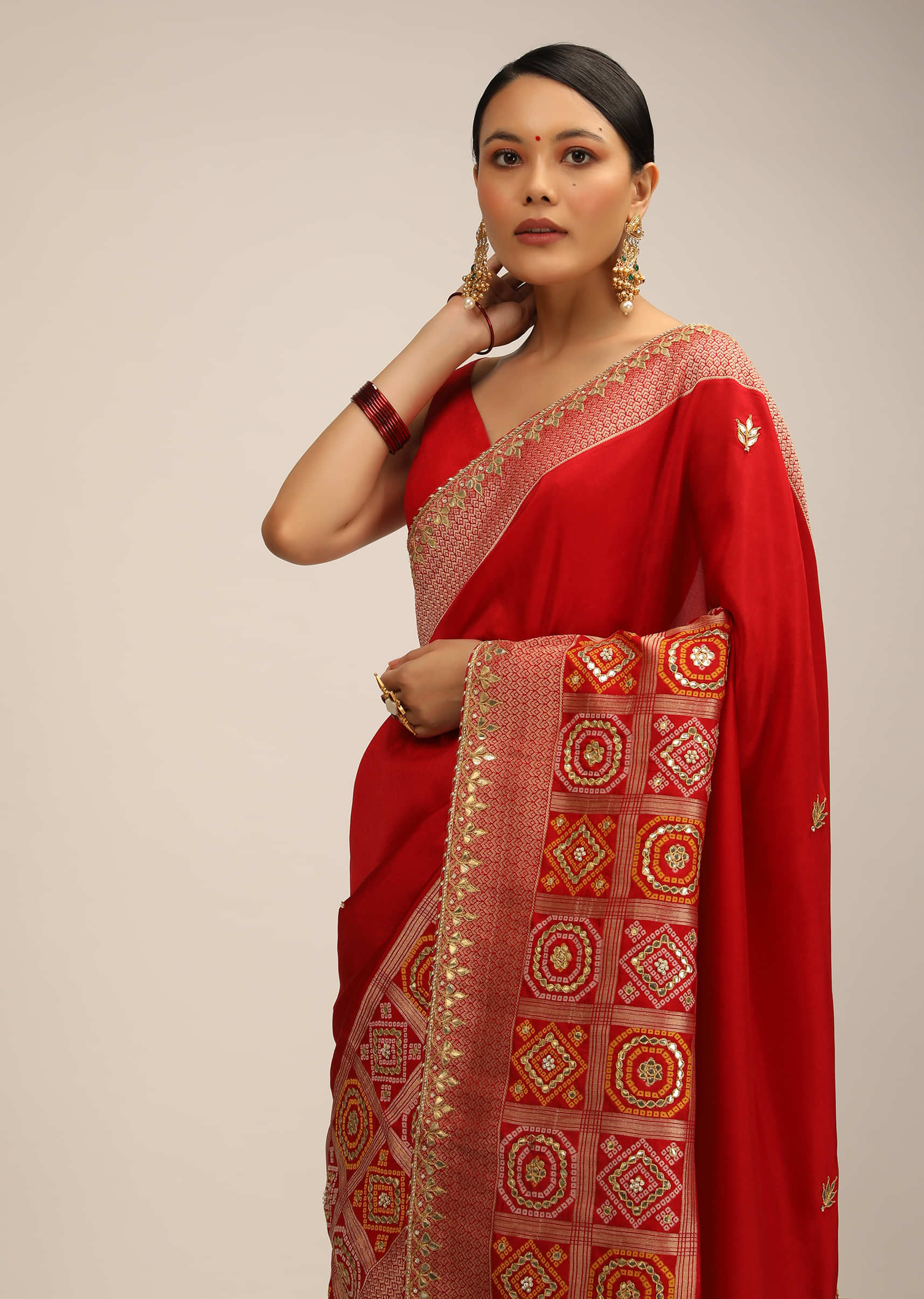 Red Saree In Silk With Brocade Geometric Design On The Border And Gotta Patti Work