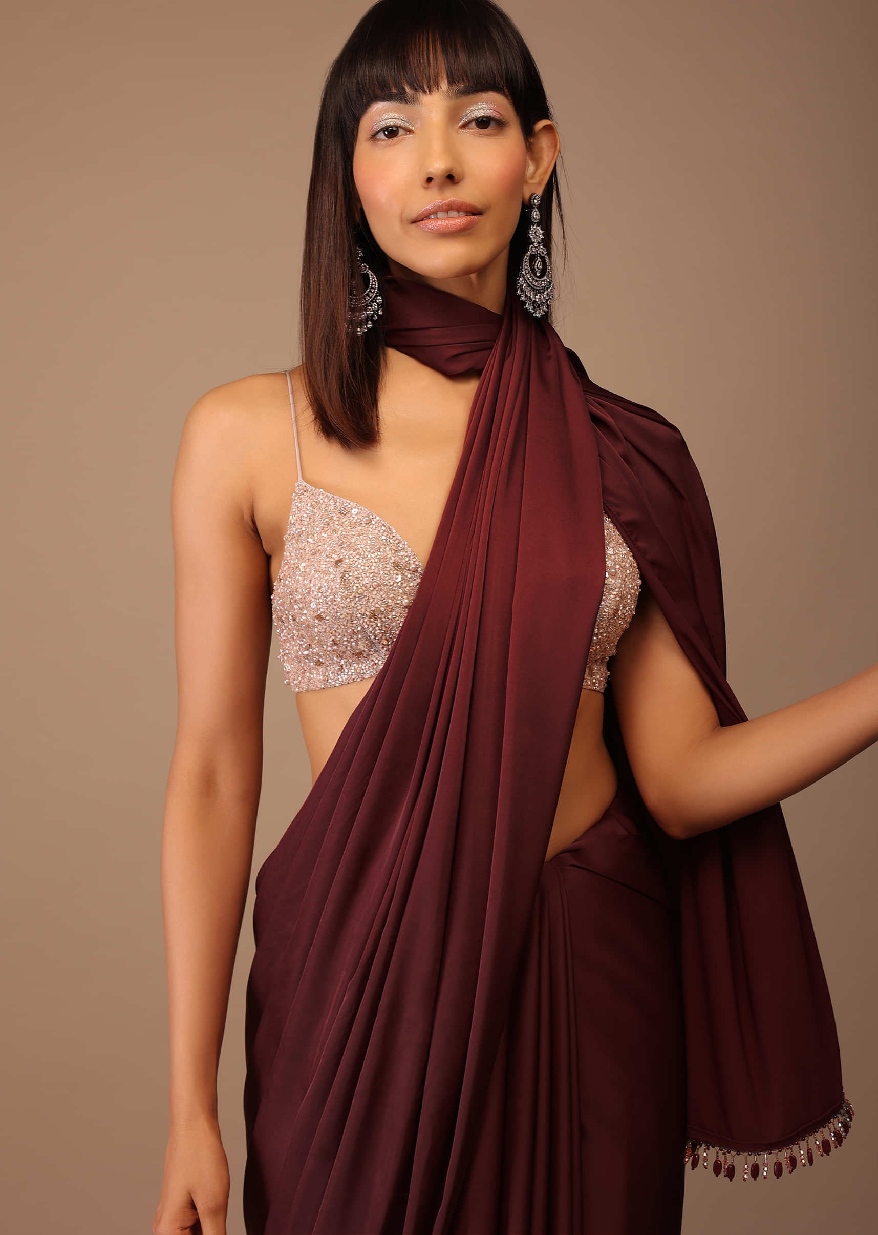 Blood Red Satin Saree With Fringes On The Pallu Paired With Hand Embroidered Bustier