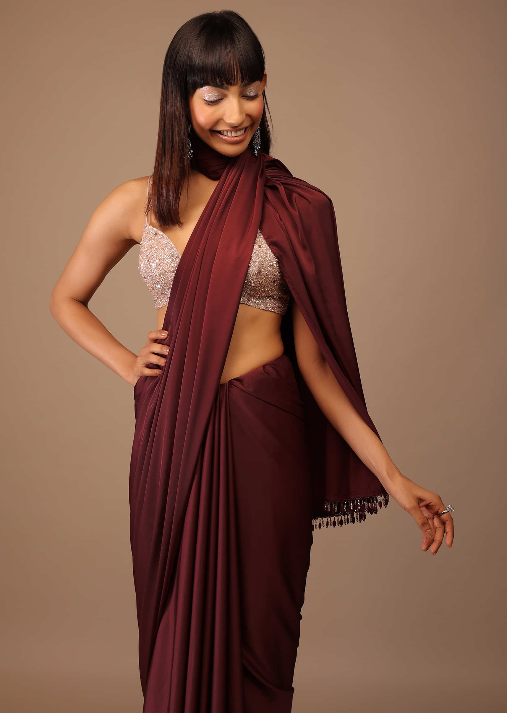 Blood Red Satin Saree With Fringes On The Pallu Paired With Hand Embroidered Bustier