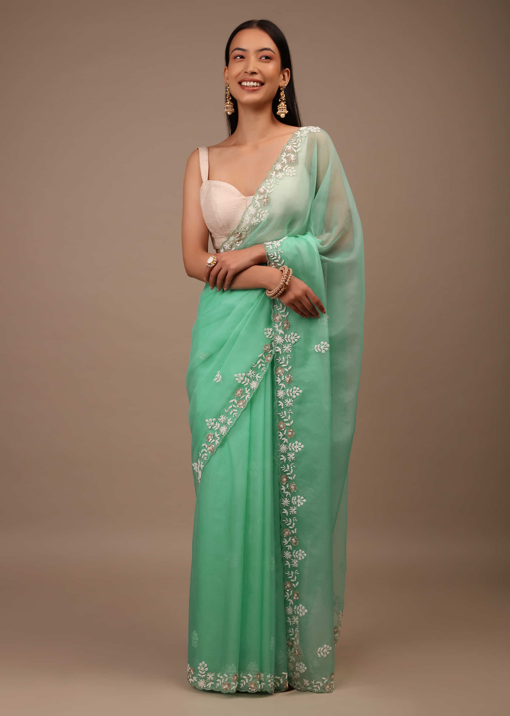 Sea Green Saree In Organza With Hand Embroidered Moti And Sequin Work On The Border And Butti Design