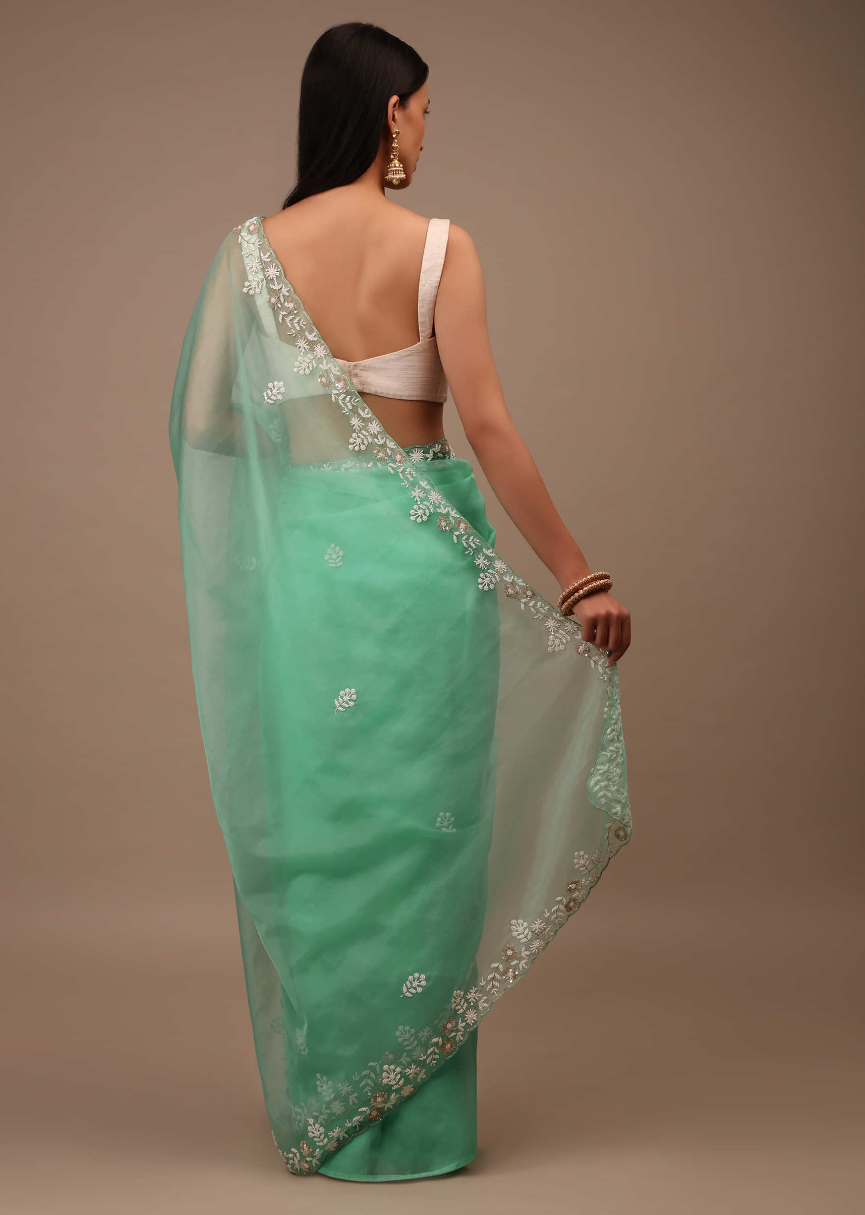 Sea Green Saree In Organza With Hand Embroidered Moti And Sequin Work On The Border And Butti Design