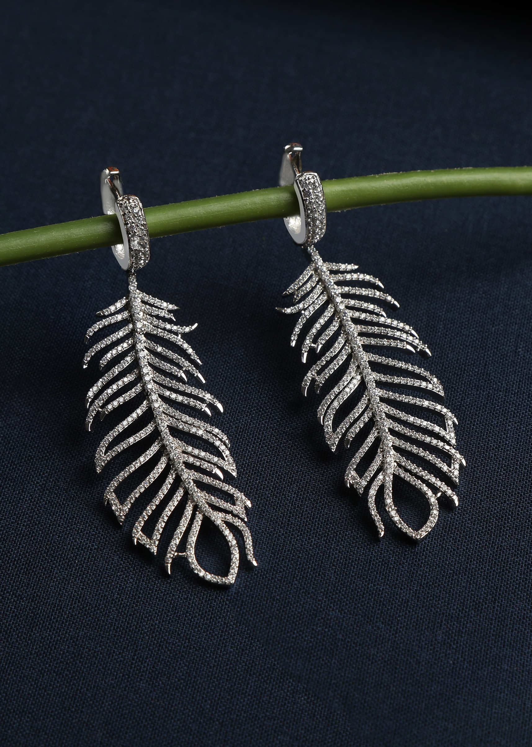 Silver Earrings With Faux Diamonds Studded In Feather Design By Tizora