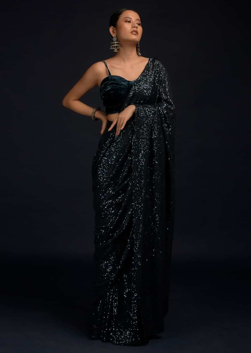 Teal Blue Ready Pleated Saree Embellished In Sequins With A Matching Velvet Blouse With Corset Neckline  
