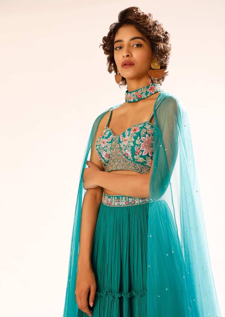 Teal Tiered Skirt And Bustier Set With Colorful Resham Embroidery And Choker With Attached Net Cape 