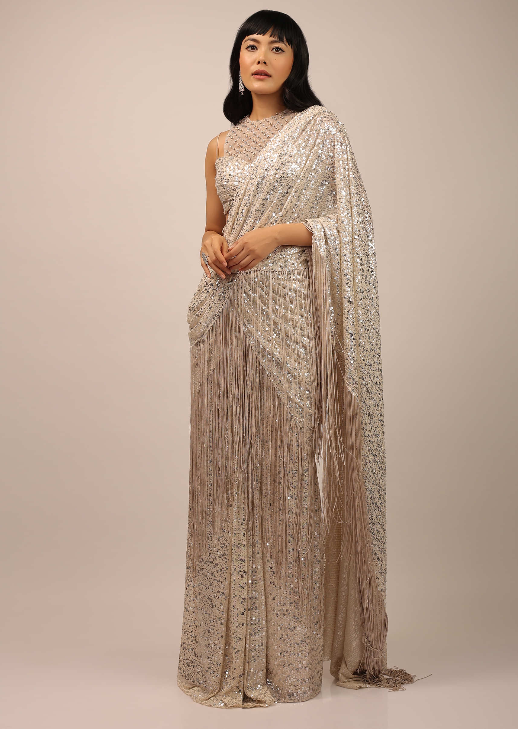 White Sequins Saree With A Fringe Border And Blouse With A Fancy Neckline