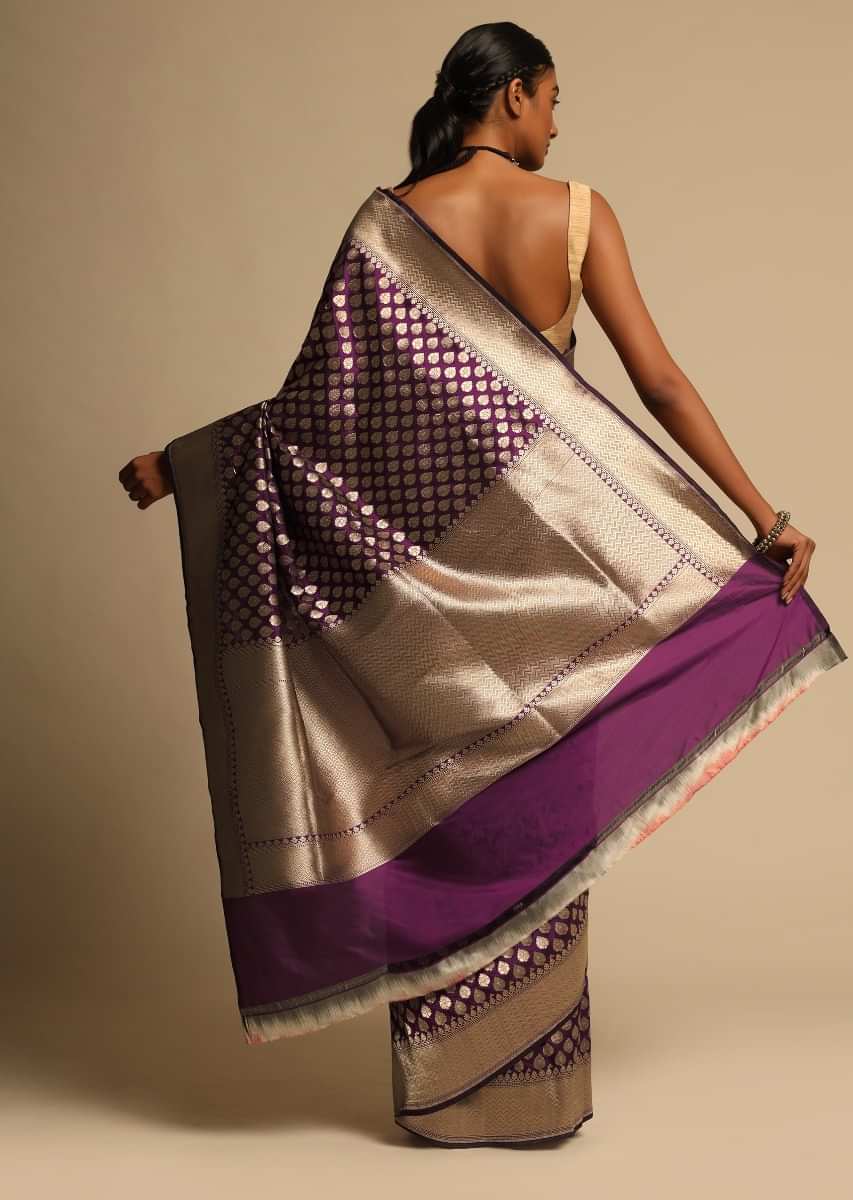 Wine Purple Banarasi Saree In Pure Handloom Silk With Woven Floral Buttis And Chevron Border Along With Unstitched Blouse Piece  