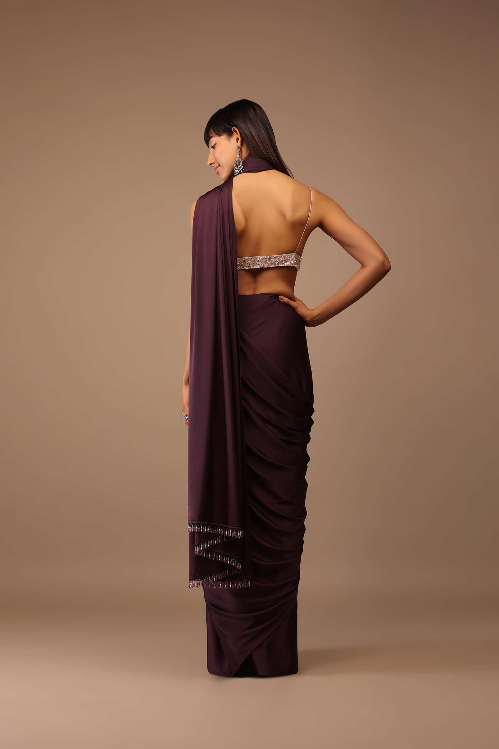 Wine Satin Saree With Fringes On Pallu Paired With Hand Embroidered Bustier