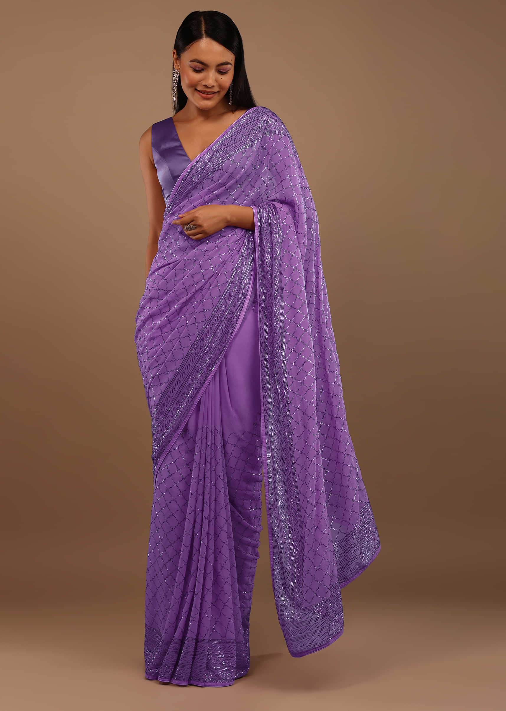 Light Purple Georgette Saree With Swarovski Stonework On The Borders And A Stonework Added Unstitched Blouse