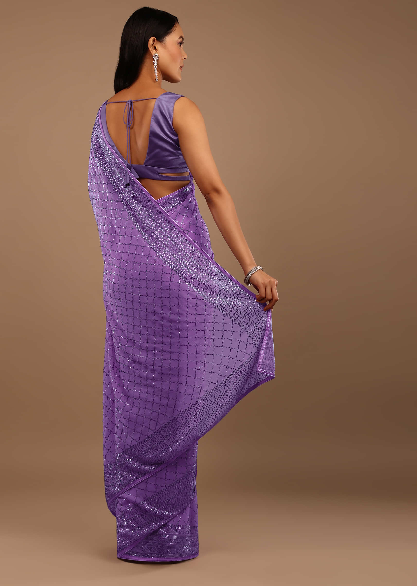 Light Purple Georgette Saree With Swarovski Stonework On The Borders And A Stonework Added Unstitched Blouse