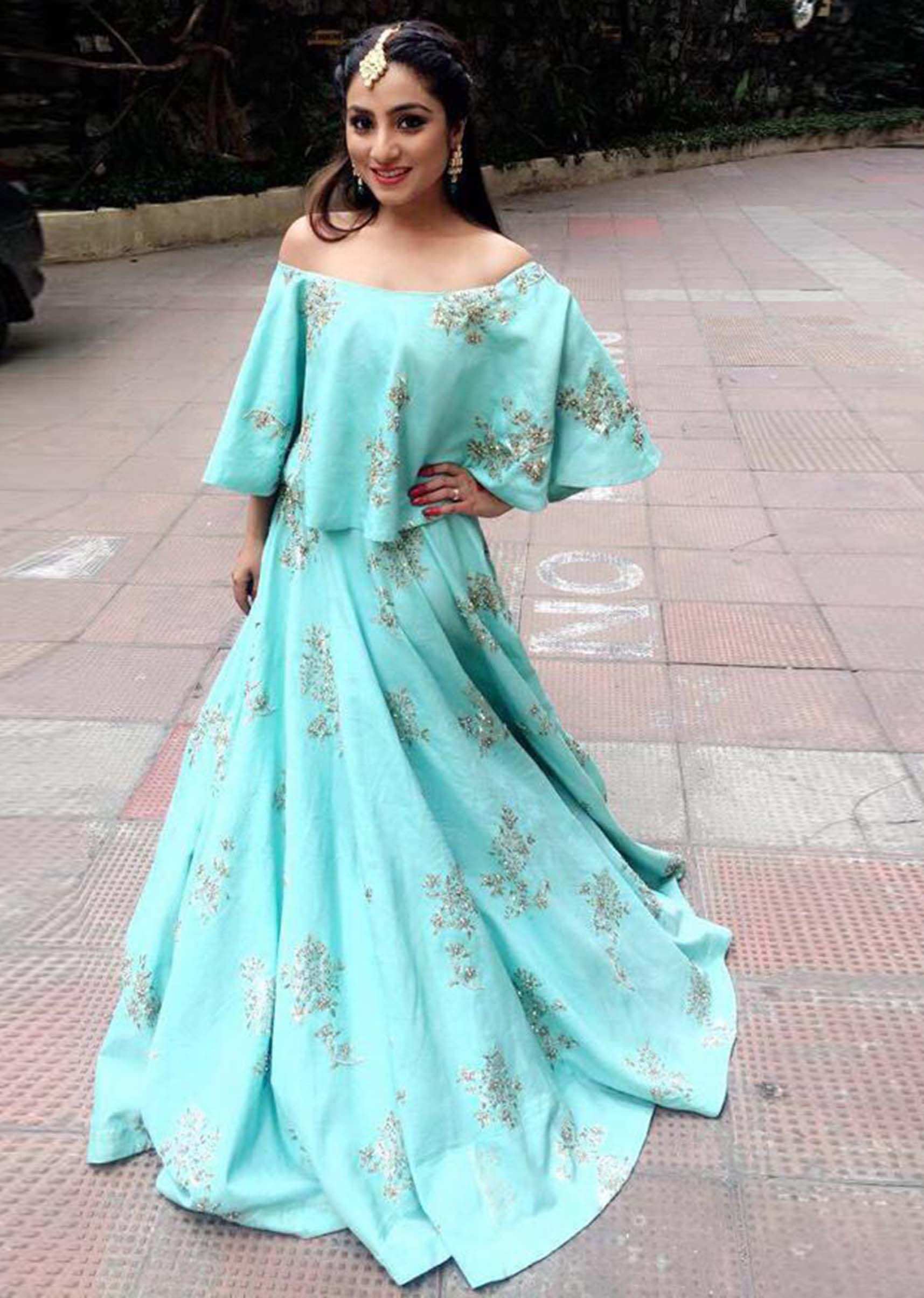 Aqua blue silk lehenga with a cape top embellished in zardosi and moti embroidery work only Kalki