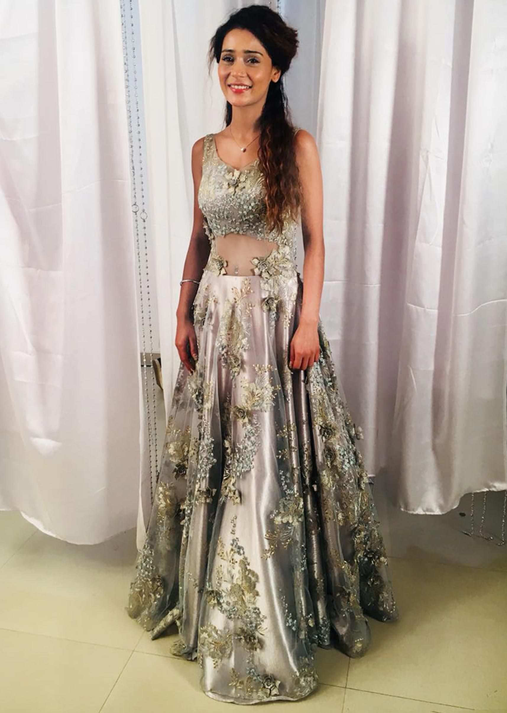 Sara Khan in Kalki silver net gown adorned with embroidered floral motifs only on Kalki