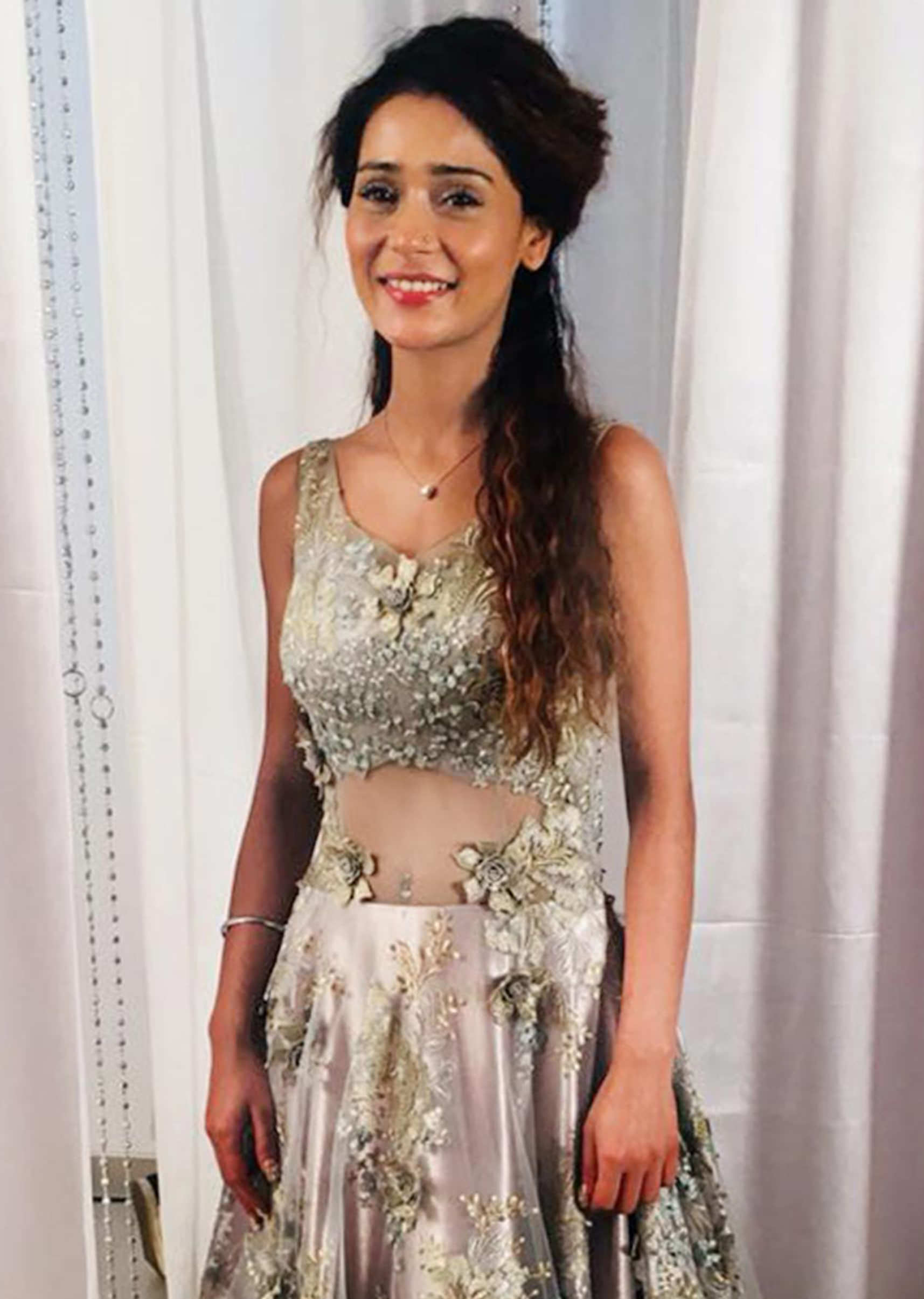 Sara Khan in Kalki silver net gown adorned with embroidered floral motifs only on Kalki
