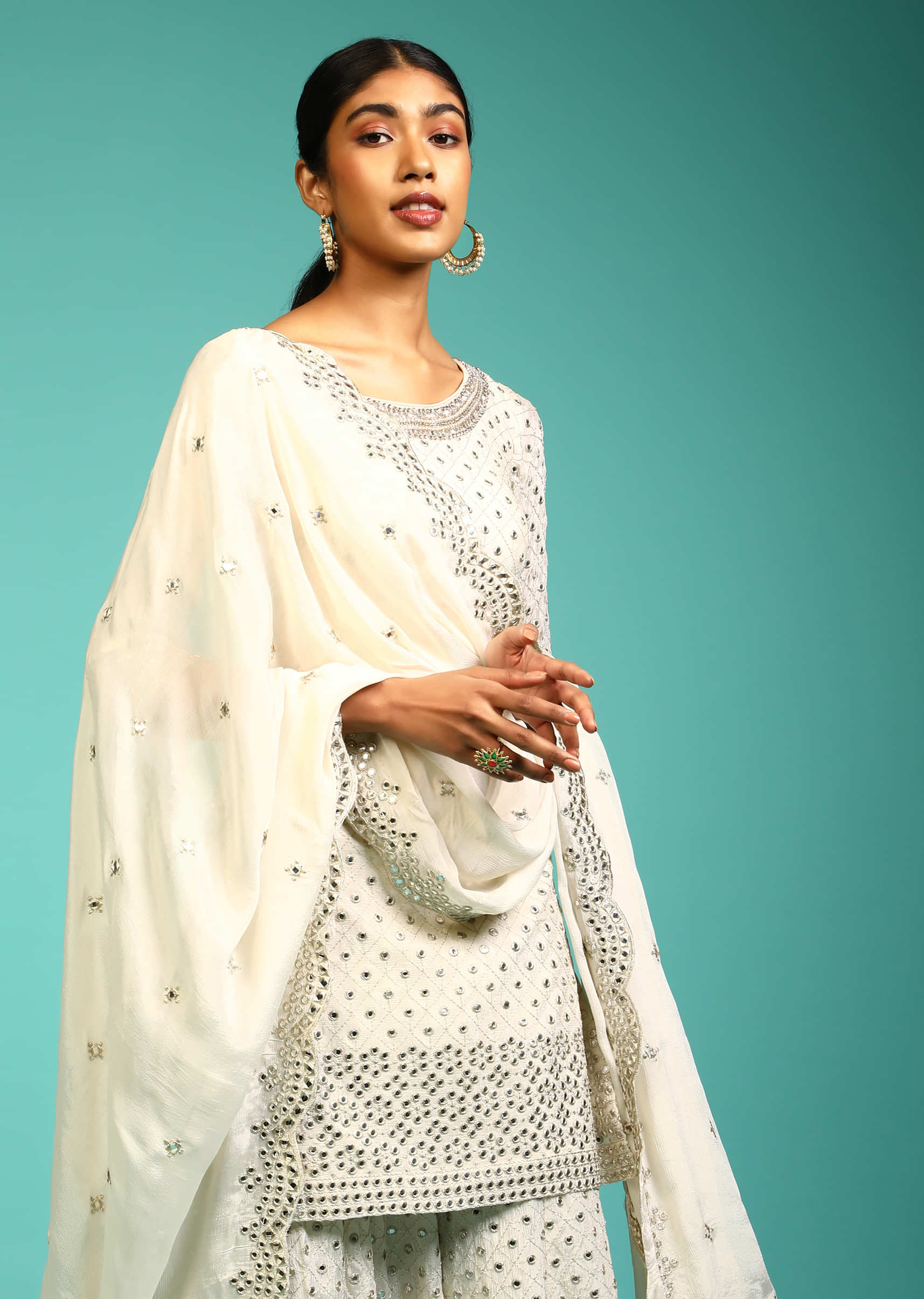 Powder White Palazzo Suit In Crepe With Zari And Mirror Embroidered Geometric Jaal Along With Heavy Border Design  