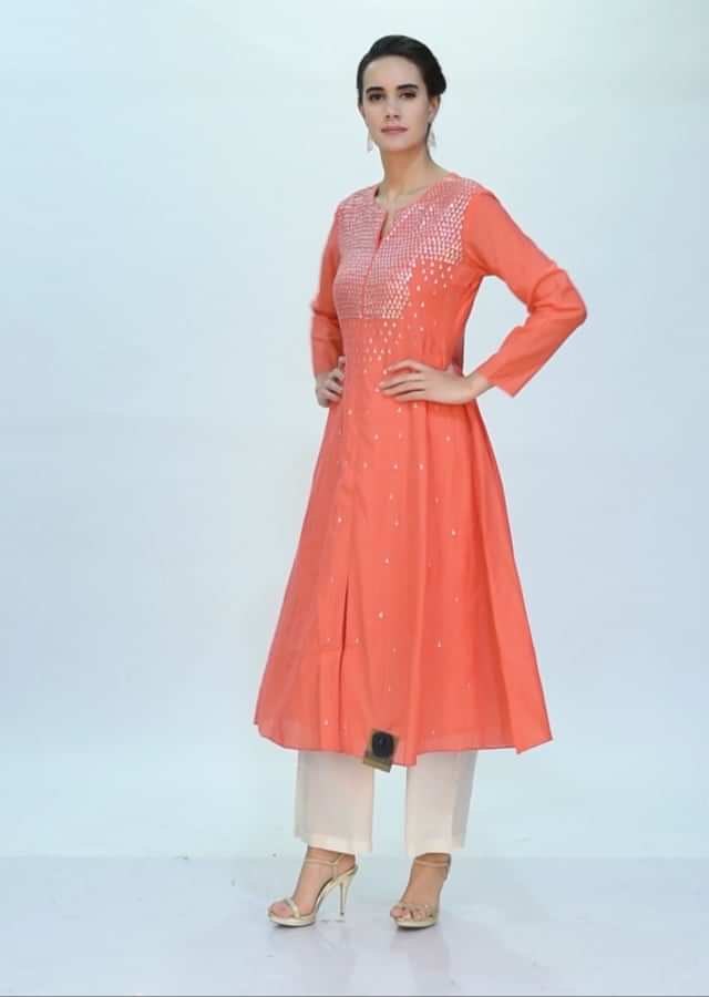 Peach cotton kurti adorn with sequins work only on Kalki