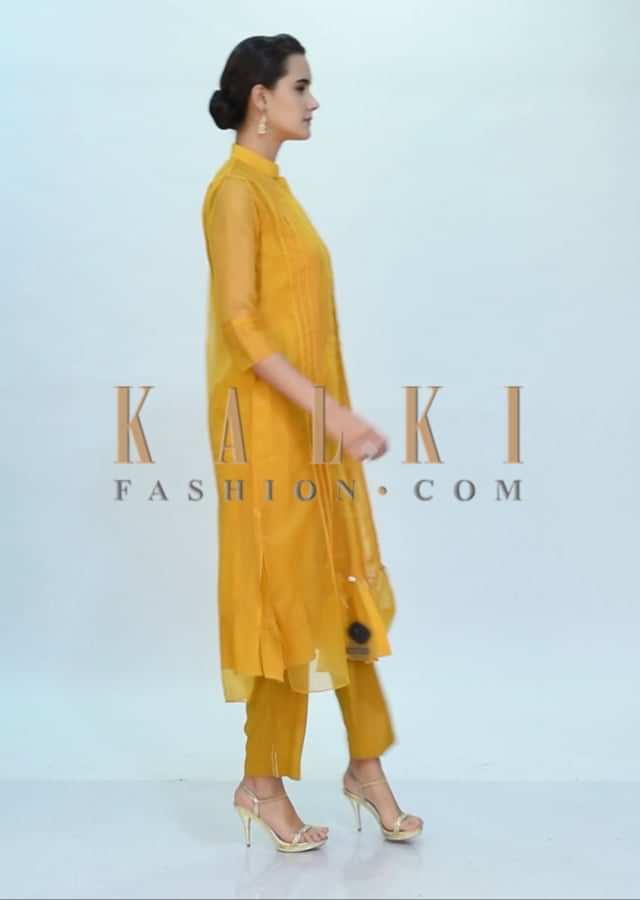 Mustard yellow three piece suit designed with pleats only on Kalki
