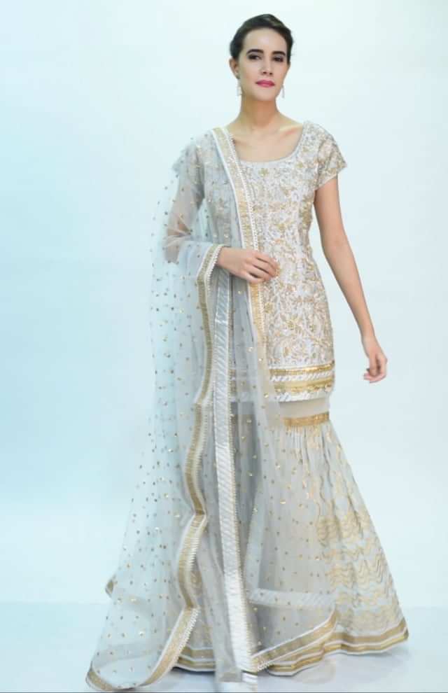 Powder blue sharara suit set in heavy lace jaal embroidery only on Kalki