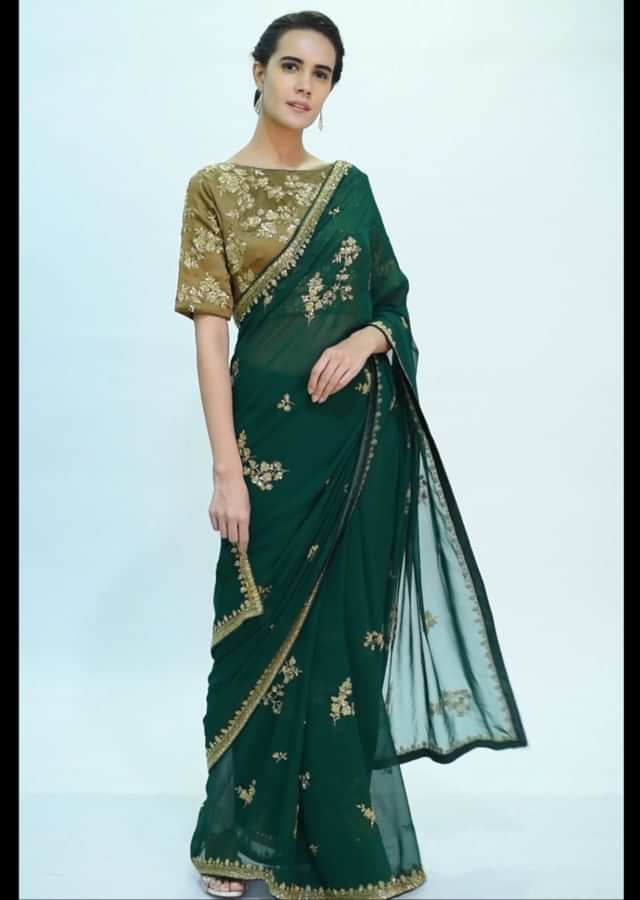 Emerald green georgette saree with embroidery and butti.  only on kalki