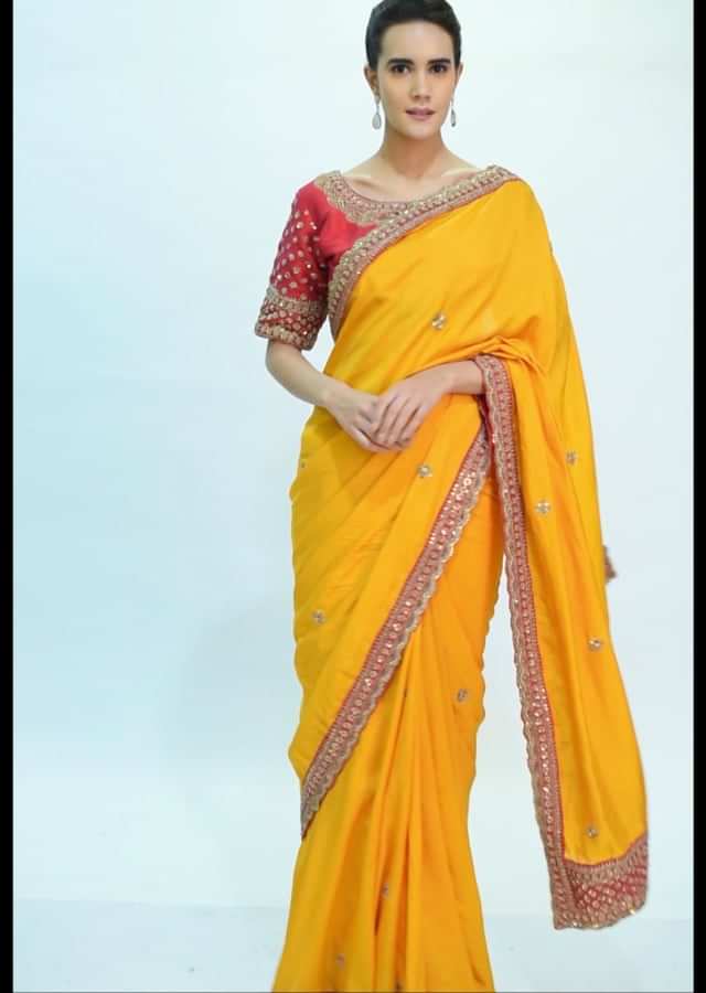 Mango yellow silk saree with embroidered butti and border only on kalki