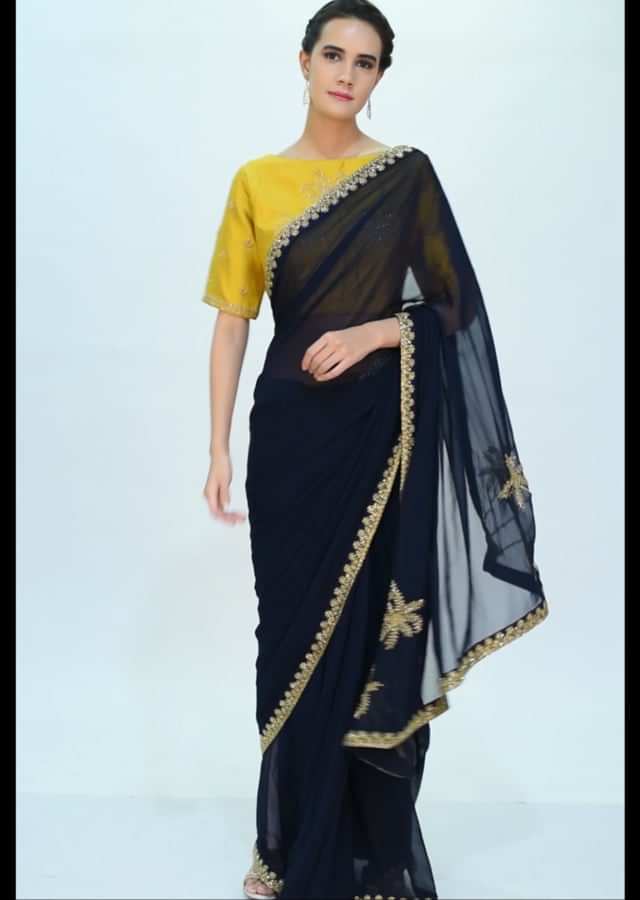 Navy blue georgette saree with contrasting mustard blouse only on kalki