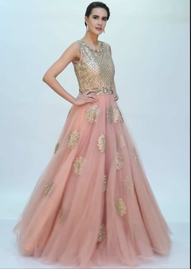 Pale pink voluminous pink net gown with butti only on Kalki