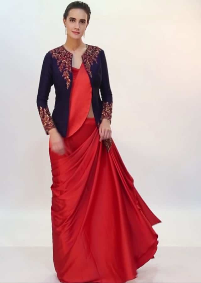 Rebel red ready plated satin saree with pleated strap blouse and navy blue raw silk jacket only on kalki