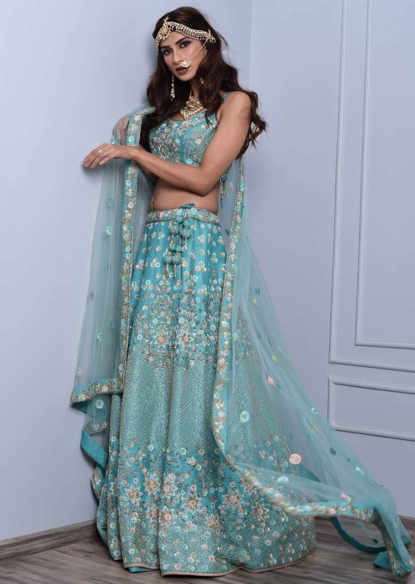 Sky blue lehenga set in heavy embroidered raw silk with floral and jaal motif Online - Kalki Fashion