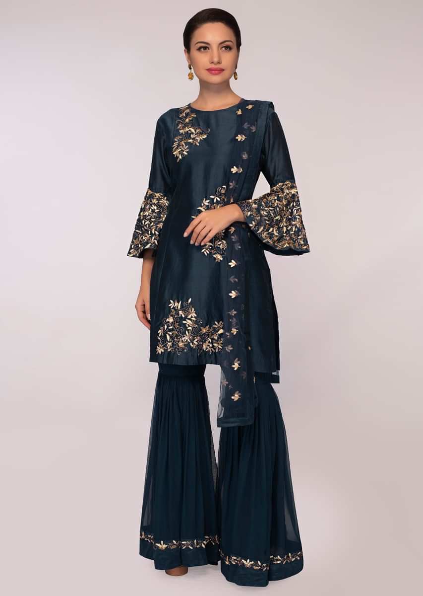 Admiral blue embroidered silk suit paired with georgette sharara and matching net dupatta