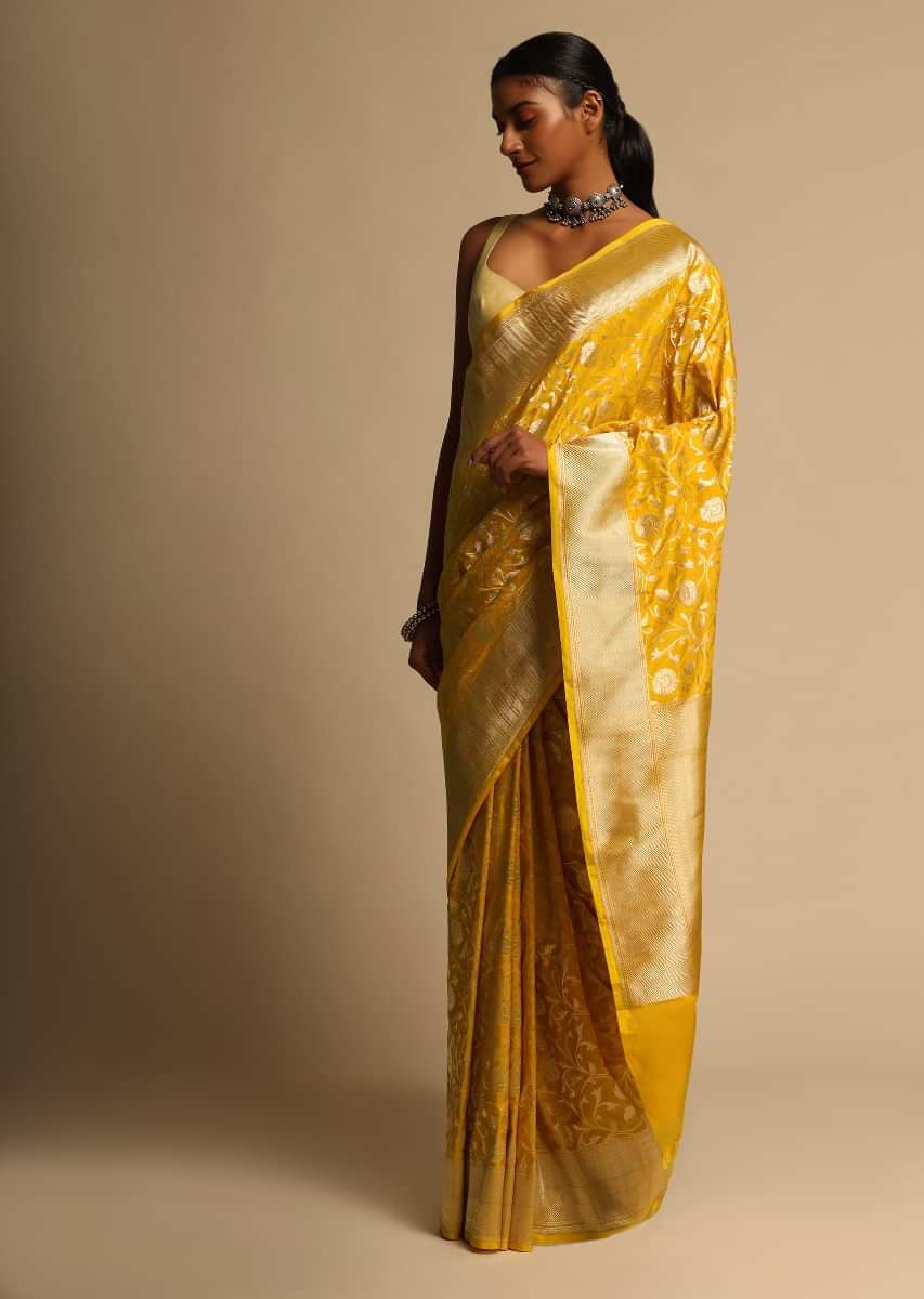 Amber Yellow Banarasi Saree In Pure Handloom Silk With Woven Floral Jaal And Chevron Border Along With Unstitched Blouse Piece