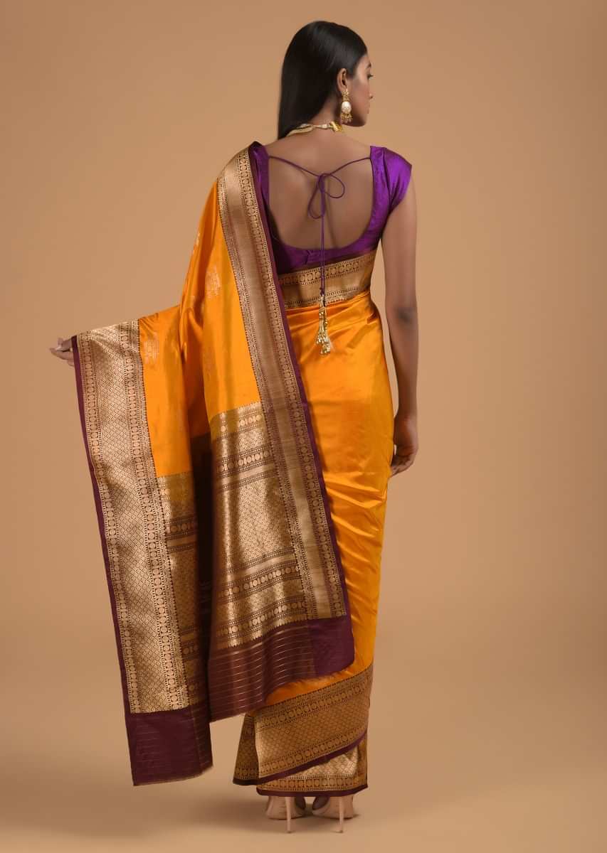 Amber Yellow Pure Handloom Saree In Silk With Woven Text Motifs And Purple Border