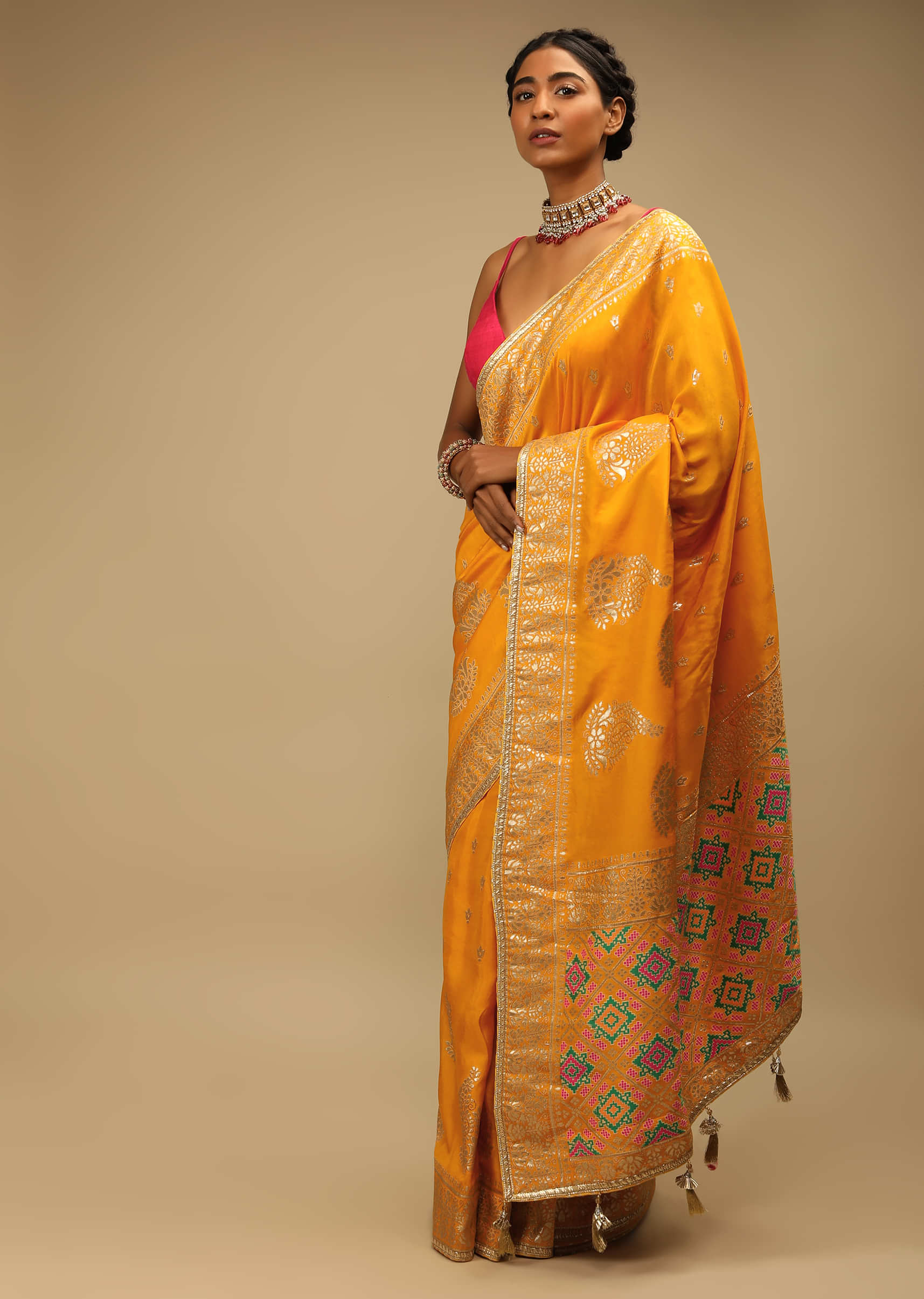 Amber Yellow Saree In Dupion Silk With Multi Colored Woven Patola Pallu And Golden Paisley Buttis All Over  