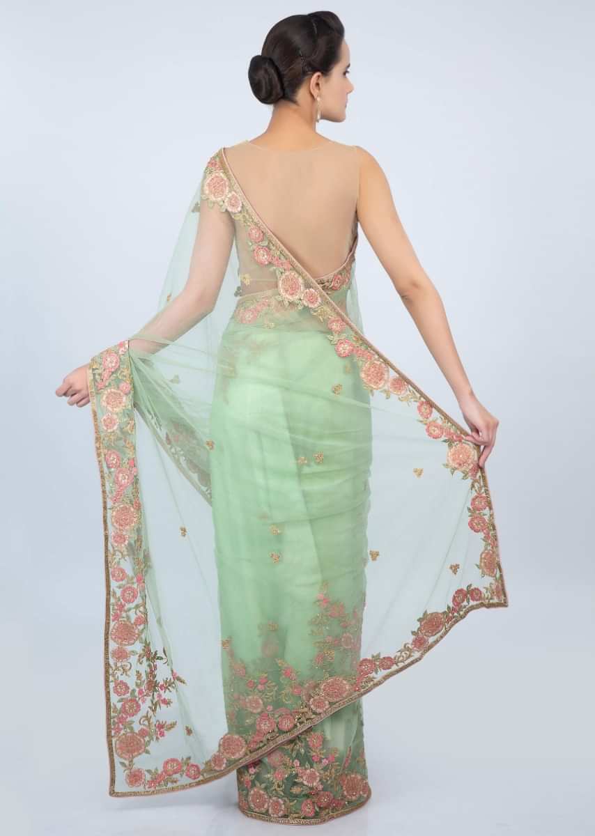 Apple green sheer net saree with floral  embroidered butti and border only on kalki