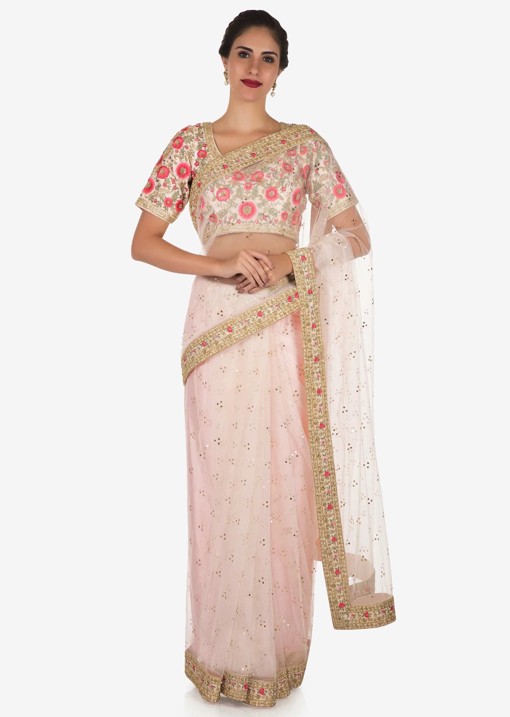 Baby pink saree in net with a ready raw silk blouse beautified in resham work only on Kalki
