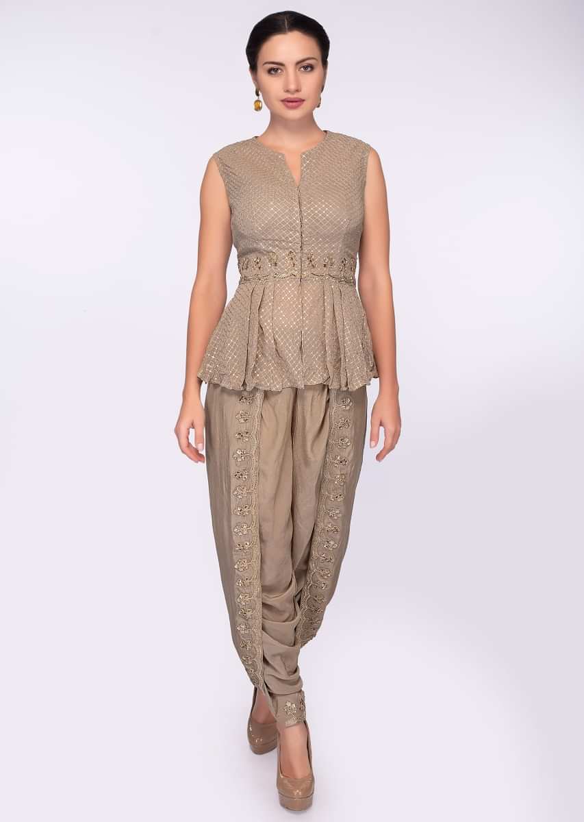 Beige fancy dhoti pant styled with matching georgette peplum top