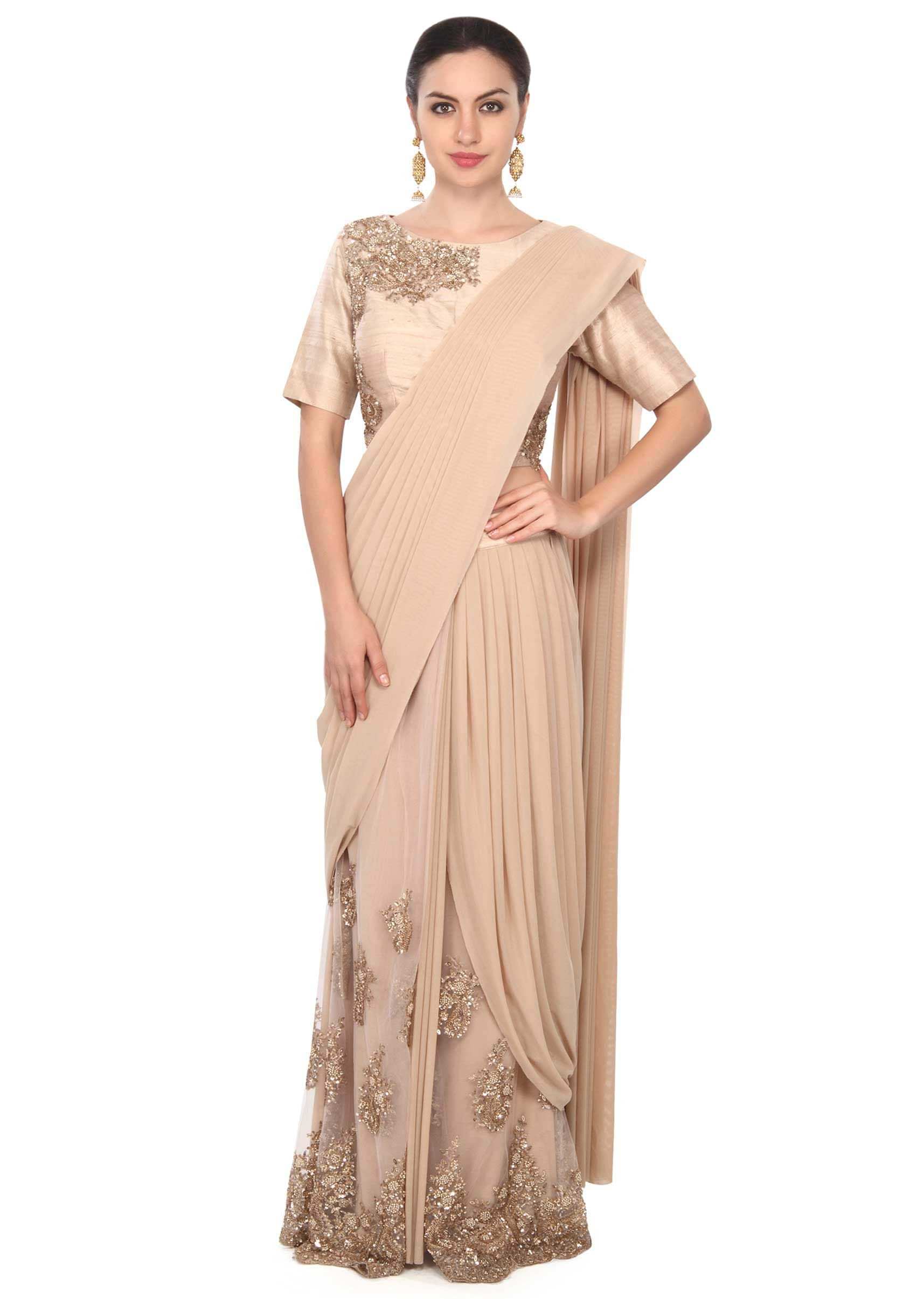 Beige saree gown adorn in pearl and sequin embroidery only on Kalki