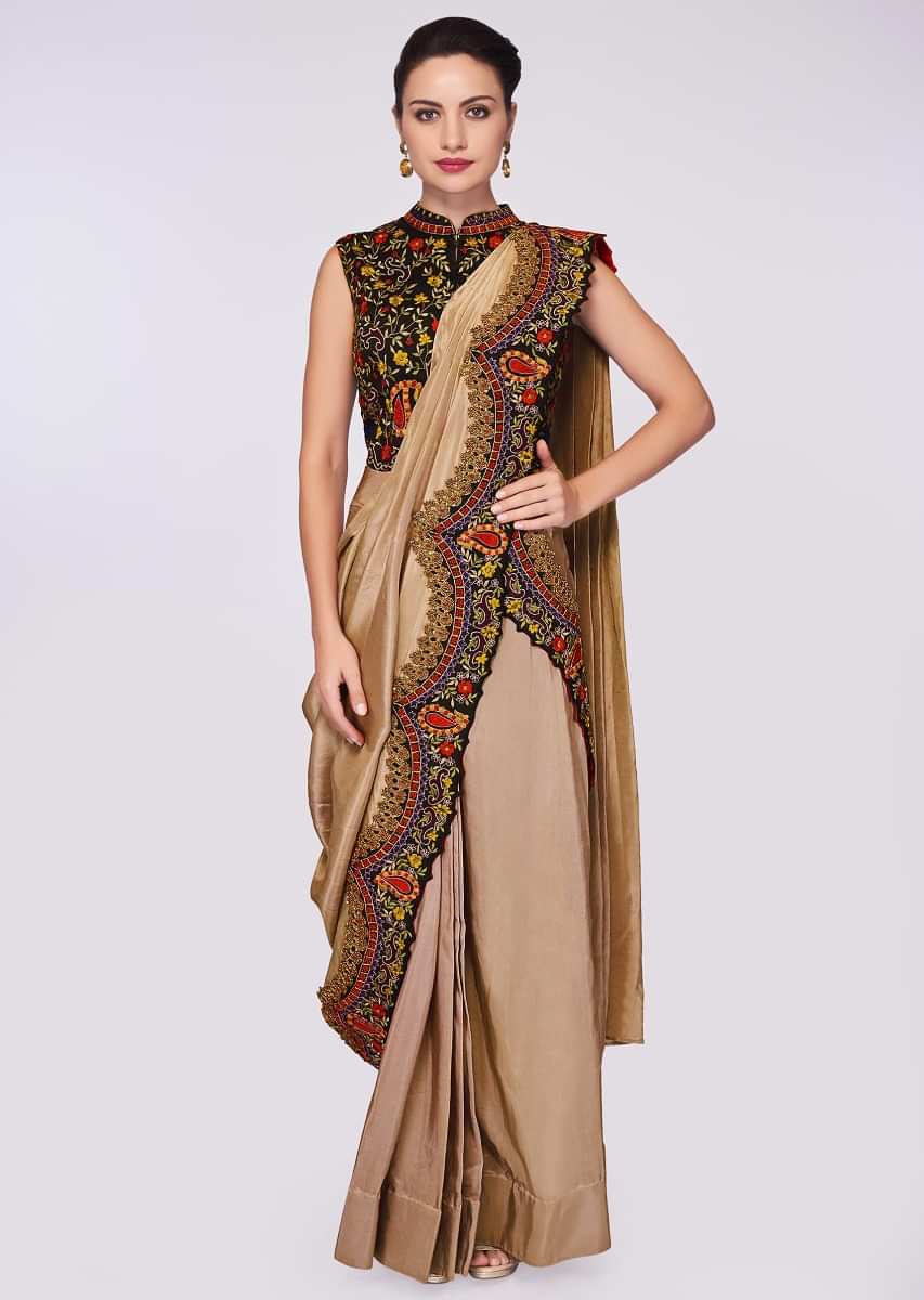 Beige silk draped saree lehenga paired with a black resham embroidered blouse 