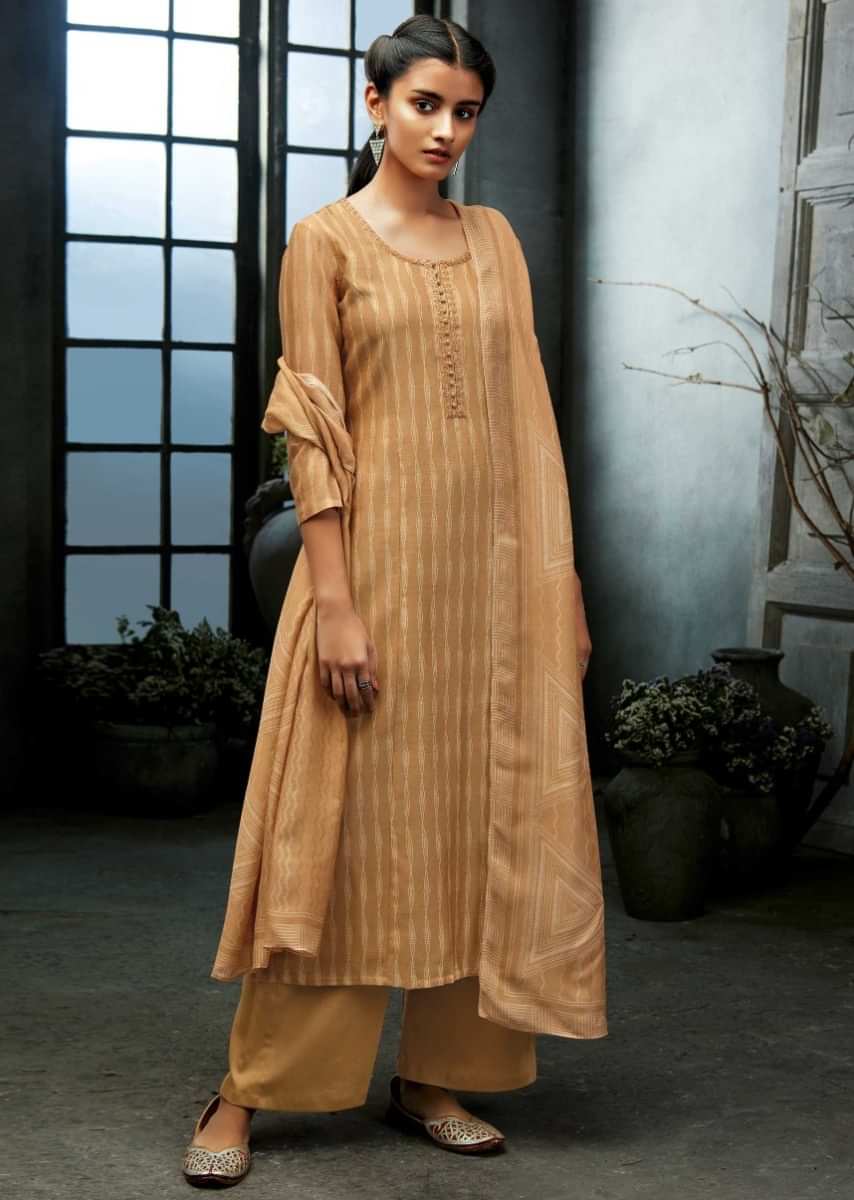 Beige unstitched suit featuring with sequin embroidered neckline