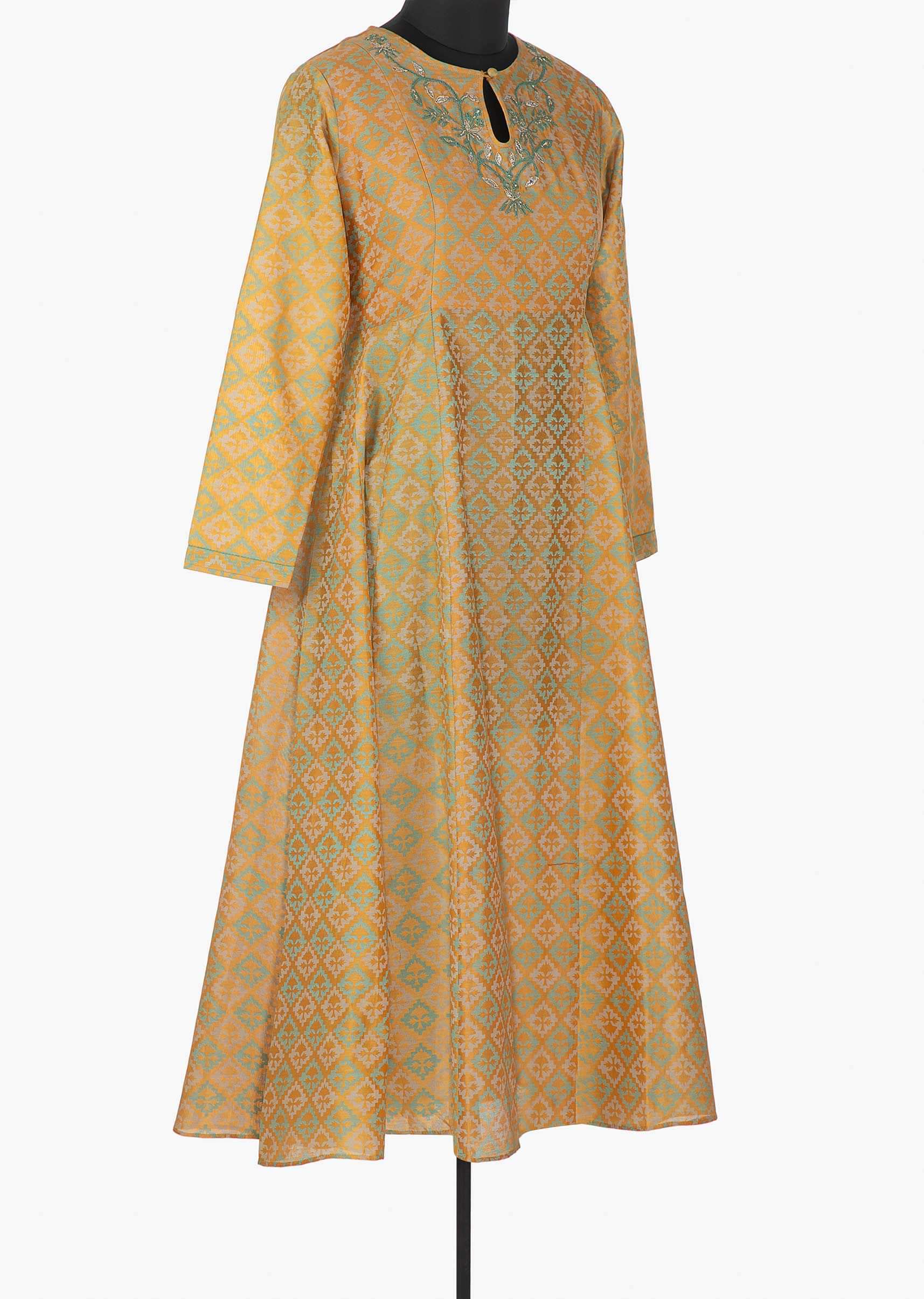 Beige yellow printed kurti with resham embroidered neckline and key hole opening only on Kalki