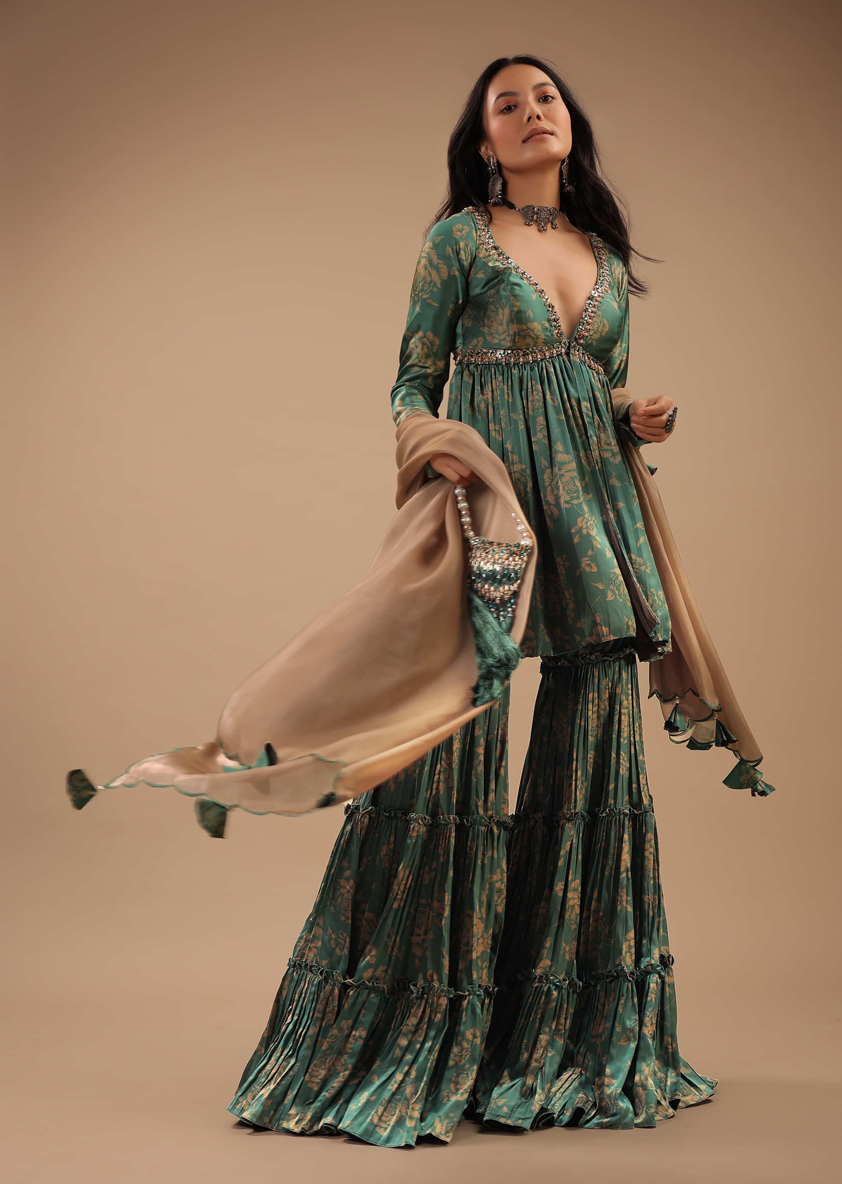Beryl Green Peplum Sharara Suit With Front Slit And Plunging Neckline. what to wear to a sangeet