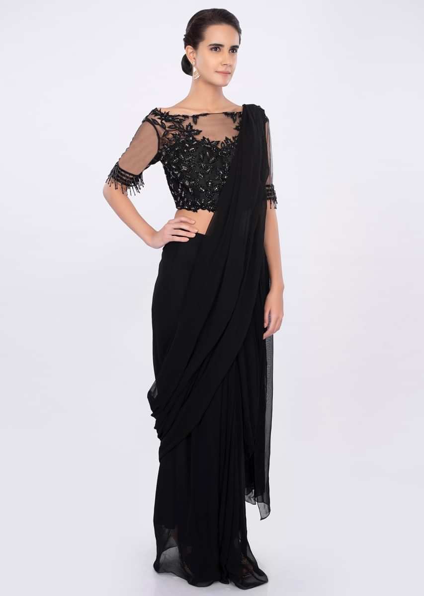 Black georgette draped saree with net embroidered blouse only on kalki