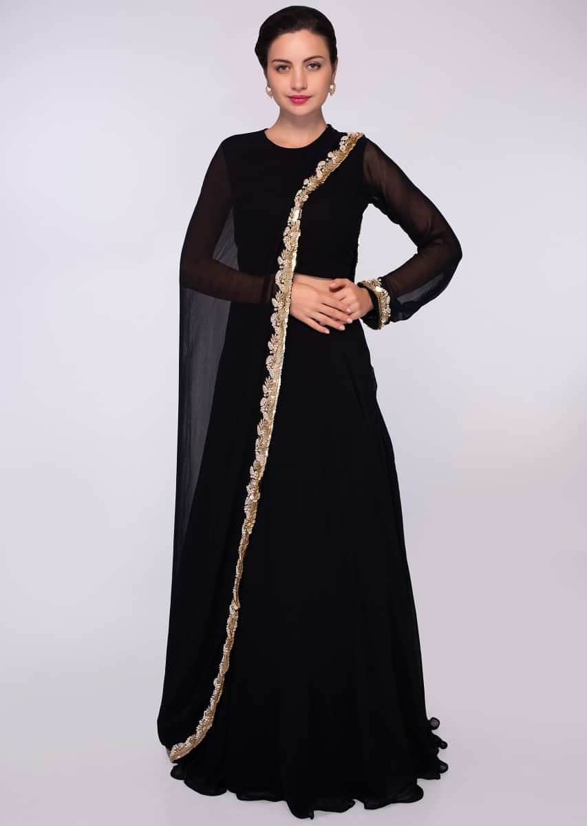 Black georgette top with one side sleeves and additional top paired with a matching skirt 