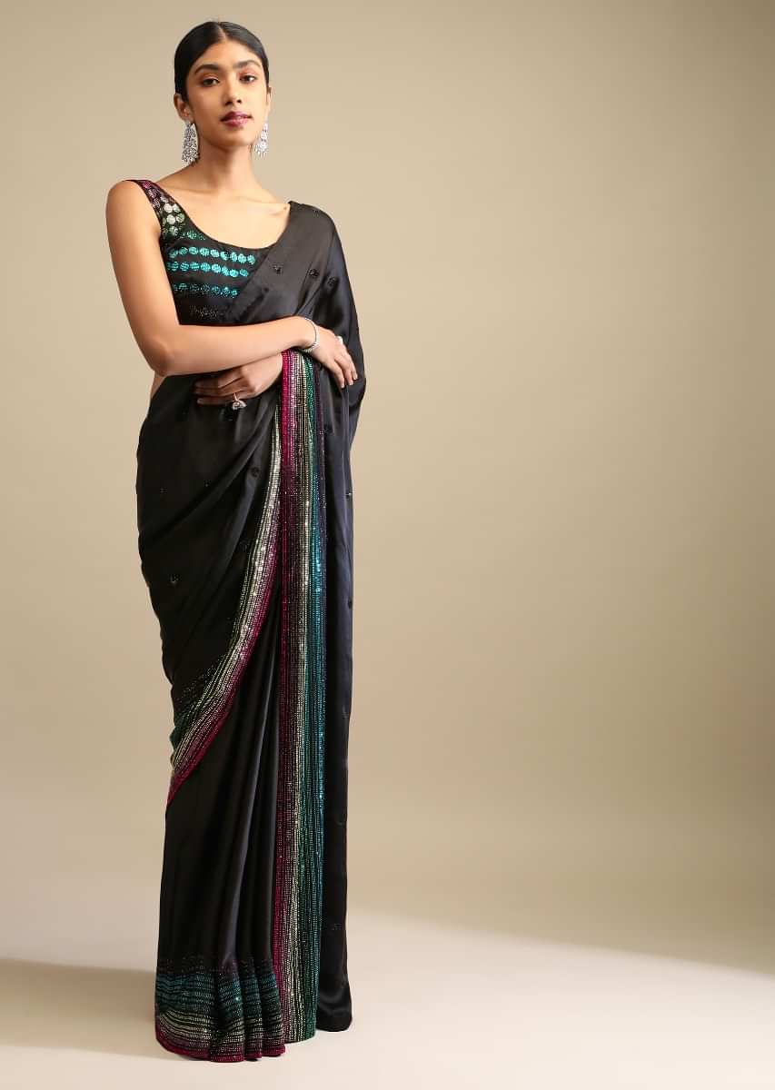 Black Saree In Satin Embellished With Multi Colored Kundan Work On The Border And Butti Work  