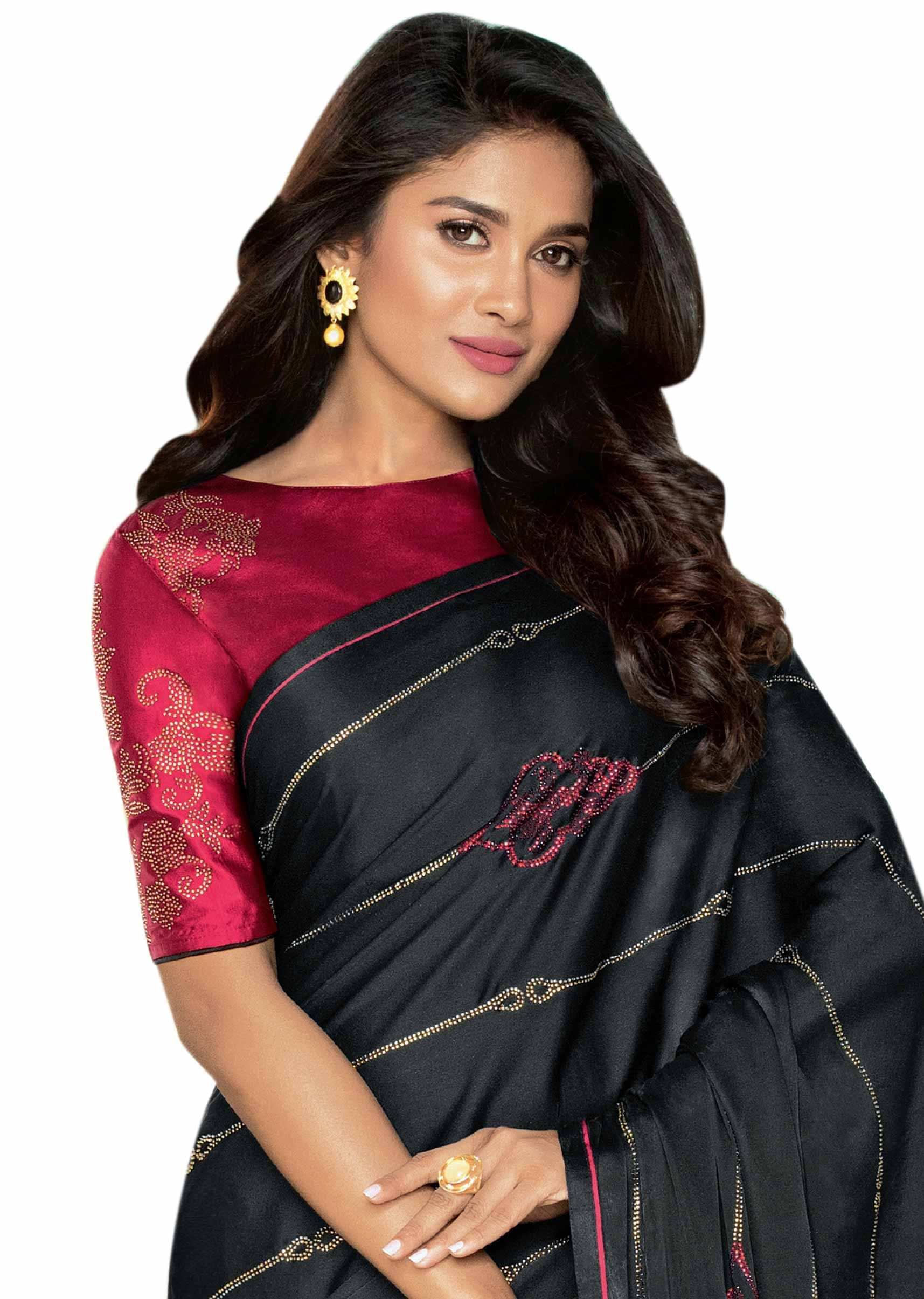 Black saree in satin with kundan work and red piping border 
