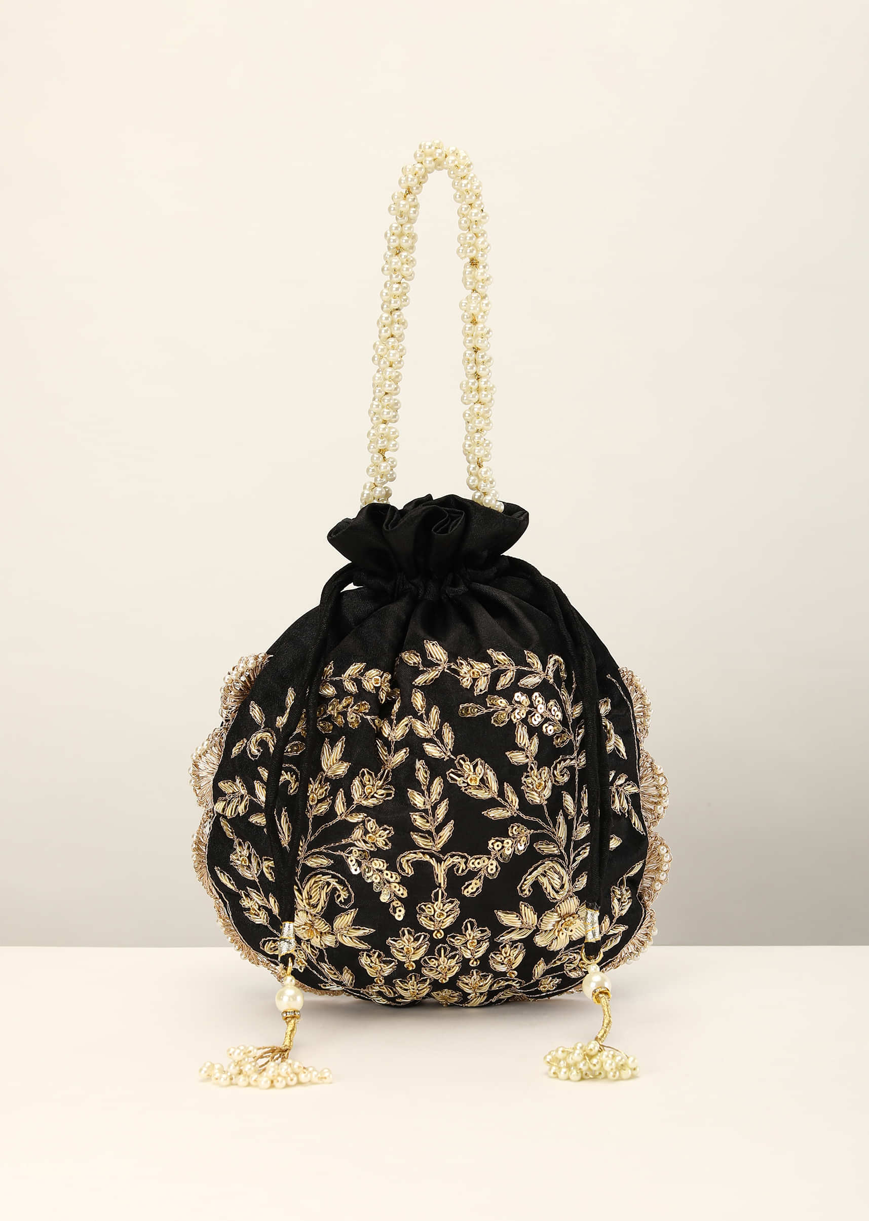 Black Potli In Satin With Hand Embroidery Detailing Using Zardosi Work In Floral Design All Over
