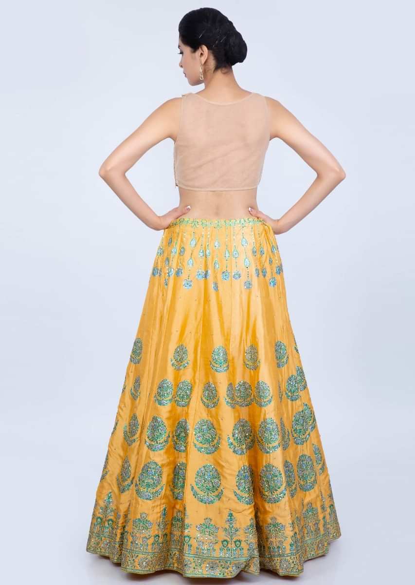 Blonde yellow printed cotton silk lehenga with contrasting pista green net dupatta only on Kalki
