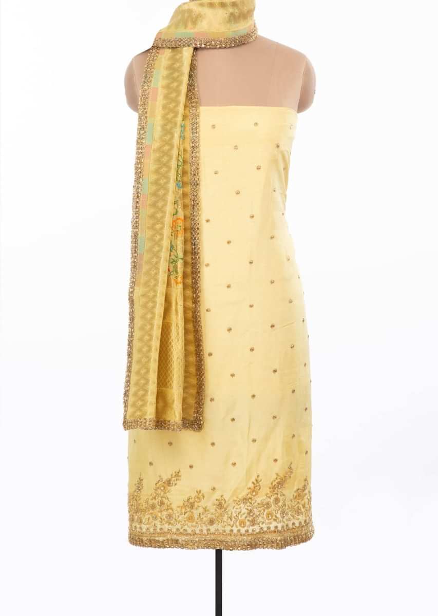 Blonde yellow unstitchedembroidered suit set with multi color weaved dupatta only on Kalki