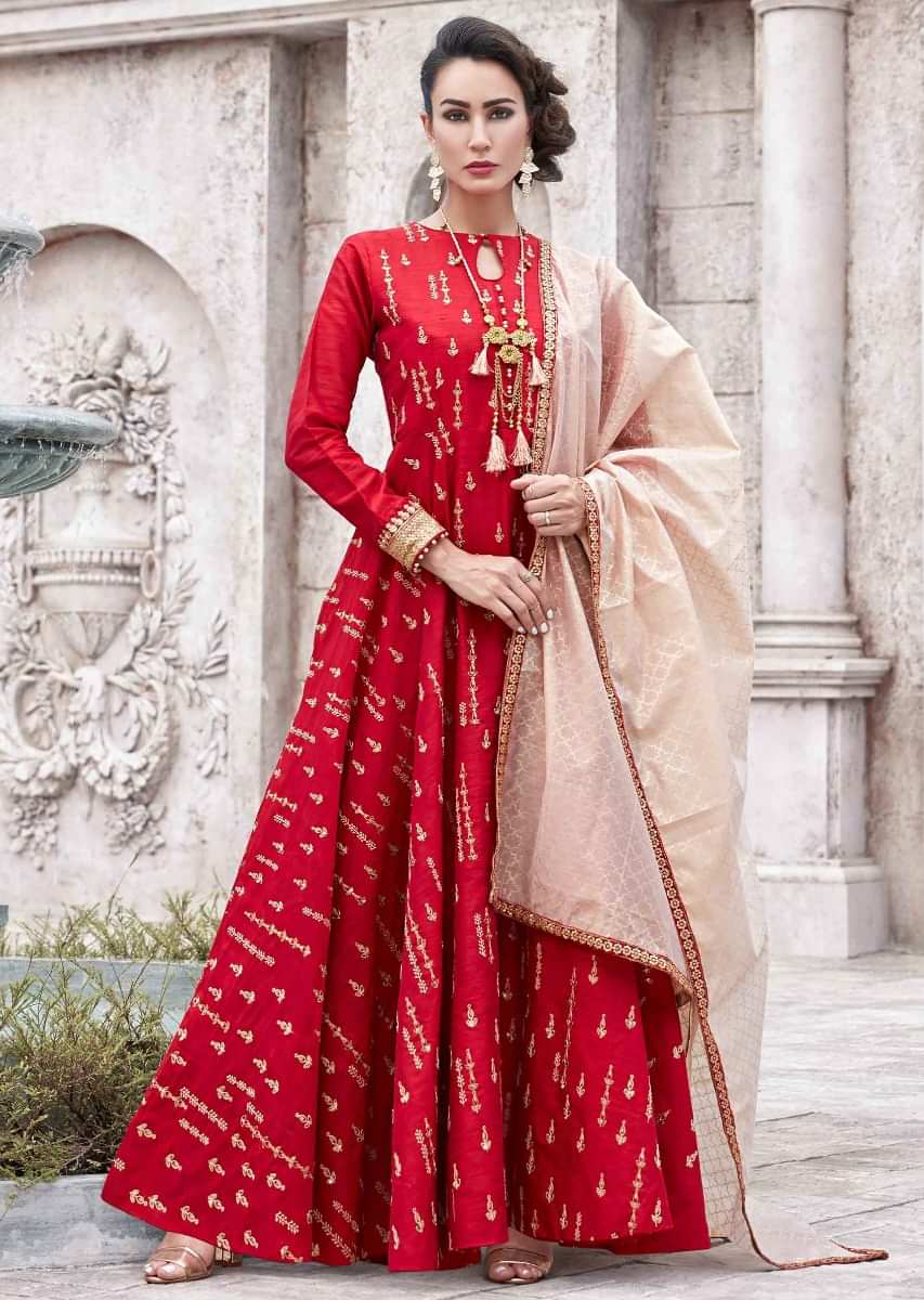 Blood red anarkali suit in raw silk with thread and zari embroidered butti all over