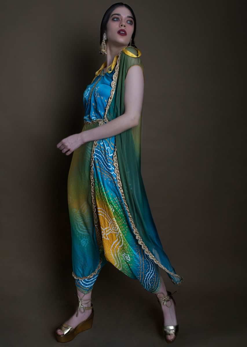 Blue and yellow shaded bandhani printed jumpsuit along with green shaded jacket only on Kalki