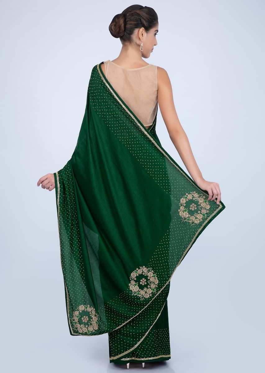 Bottle green dupion silk saree with cut dana and bead embroidered pallo and border only on kalki